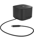 Level Up Your Workspace With This Slick Thunderbolt Dock 230W, compact black hub showing USB and Thunderbolt ports, connected with cable.