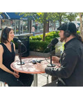 Two hosts recording a podcast outdoors with dynamic mics and headphones for The Ultimate Two Host Podcast Stack Featuring Multitrack Recorder And Dynamic Mics Paired With Headphones Shielded Xlr Cables Tripod Stands And Foam Windscreens For Streaming That Sounds Gnarly And Helps You Drop Bangers On Daily Grind.