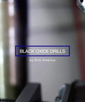 Black oxide drill bit in action with label, part of Five Piece Extra Long High Speed Steel Drill Bit Set For Everyday DIY Drilling Includes 1/4 Inch 5/16 Inch 3/8 Inch 7/16 Inch And 1/2 Inch Bits With 12 Inch Overall Length Built Tough For Heavy Duty Jobs.