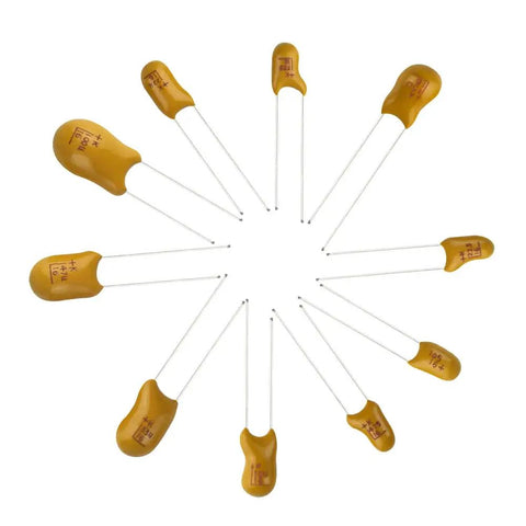 Rock Solid Tantalum Capacitor Assortment Kit Featuring One Hundred Pieces Across Ten Distinct Values Ranging From One To One Hundred Microfarads At Sixteen Volts Inside A Nifty Storage Box. Various tantalum capacitors displayed in a spiral arrangement.