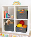 Kick Clutter To The Curb With This Big Slick Gray Woven Storage Basket Featuring Sturdy Cut Out Handles For Roomy Home Organization And Chic Display ThatSeriously Saves Valuable Floor Space Now in a shelving unit filled with toys.