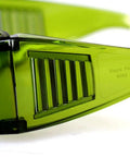 Close-up of Top Tier Laser Safety Goggles With Wide Spectrum Filtering And Slick Polycarbonate Frames, showcasing green tinted lenses.