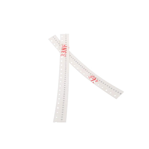 Top Shelf 0402 SMD Ceramic Capacitor Assortment Kit Featuring Thirty Different Values And A Massive One Thousand Two Hundred Piece Total Spanning One Picofarad To Ten Microfarads For Serious Tinkering And Smooth Builds showing two clear capacitor strips with printed values of 33nF and 10uF.