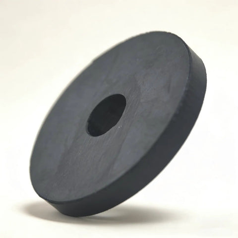 Tough As Nails Natural Rubber Motor Mounts Kick Ass Vibrations From Compressors And Heavy Duty Equipment Easy Bolt Through Installation Boss Grade Damped Pads 8 Pack round black rubber mount with central hole floating on a neutral background.