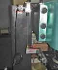 1000mm Draw Wire Encoder with 24V DC supply and 0-10V output installed in factory automation machinery