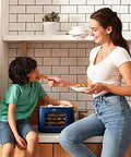 Digital Electric Food Dehydrator With Four Stackable Stainless Steel Trays And Precision Temperature Controls featuring a woman feeding a child healthy snacks.