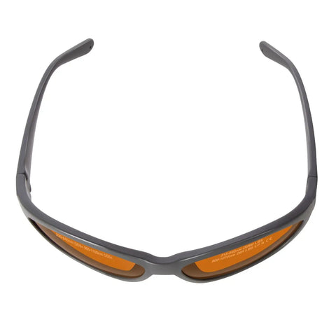 Pro Grade Laser Safety Glasses Serving Up Dead Straight Vision And Knockout Defense Across Two Hundred To Five Hundred Forty Nano Meters Plus Eight Hundred To One Thousand One Hundred For Q Switched Tattoo Removal And Med Spa Treatments Daily, orange tinted with gray frame.