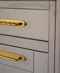 Five Inch Antique Brass Cabinet Pull Handles With Timeless Oval Backplates, Hella Durable Zinc Alloy Drawer Knobs For Kitchen Cabinets And Dressers, Rust Proof Two Pack Slick Smooth Handle Grip mounted on gray drawers.