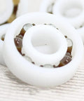 Premium Pom Plastic Ball Bearings 5 Piece Kit close-up of white bearing showcasing self dry lubricant and robust design.
