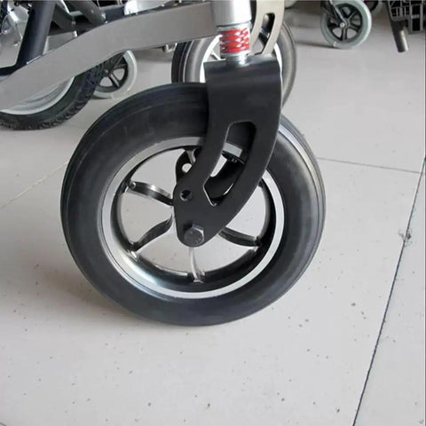 Plug And Play 10 Inch Solid Rubber Tires For Electric Wheelchairs With Aluminum Hubs And Grippy Tread That Rolls Smooth For Heavy Duty Mobility Scooters And Hospital Stretcher Two Pack Gray close-up view of tire on wheelchair.