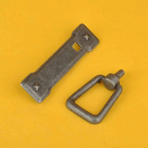 Rustic Farmhouse Cabinet Pulls Two Pack Zinc Alloy Drawer Handles Antique Iron Black Finish For Kitchen Cabinets And Dresser Drawers showing handles on yellow background.