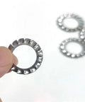 Close-up of a Stainless Steel 304 External Toothed Washers Set 300 Piece Serrated Lock Gasket Assortment DIY Friendly for Bolts and Fasteners