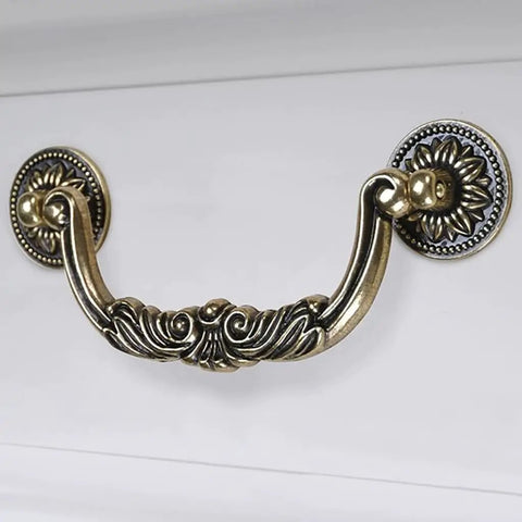 Straight Up Vintage Antique Bronze Drop Bail Pulls With Slick Carved Texture Top Shelf Cabinet Handles For Drawers And Closets Featuring 3.8 Inch Hole Centers showing detailed design.
