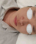 Premium Disposable Laser And Ipl Led Eye Shields Pro Grade Cosmetics Safety Pads Od7 Uv Blocking Heavy Duty Spa Facial Treatments 50 Pairs Black Straight Up Client Protection on a client during a facial.