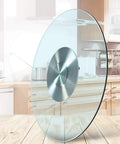 Kickass Heavy Duty Lazy Susan Turntable With Thick Tempered Glass Top And Stainless Steel Bearings for smooth spinning on a kitchen table.