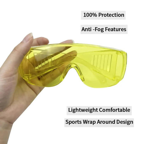 Heavy Duty Anti Fog Yellow Safety Goggles Real Deal Protective Eyewear Built To Go Over Prescription Specs For Dental Labs Teeth Whitening And Smooth Daily Construction Work in a hand, showcasing lightweight wrap around design.