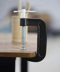 Heavy Duty 4 Inch C Clamp Set In Steel clamping a wooden surface, showing anti wear and rust resistant body and high strength screws