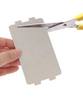 Person cutting Six Pack Microwave Waveguide Mica Sheet Covers For Heat Insulation And Splatter Guard Replacement Pads