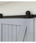 Extra Heavy Duty Industrial Barn Door Hardware Kit 15 FT Rail System showing smooth nylon wheels on a blue wooden door.