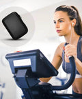 Badass Rugged Hard Drive Case For Portable SSD And HDD Universal Storage Organizer Pouch shown on exercise bike.