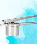 Slick Manual Citrus Squeezer With Long Handle Lever Hella Durable Stainless Steel for lemons and limes against a blue background.