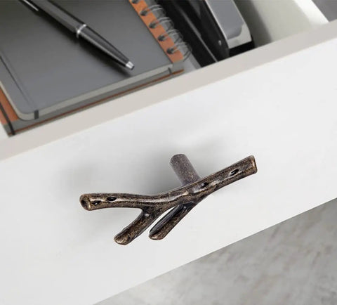 Hella Stylish Tree Twig Cabinet Knobs 6 Pack Bronze Zinc Alloy Drawer Pulls Solid Build For Mountain Cabin Kitchen Cupboard Single Hole Hardware With Screws on a drawer.
