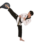 Heavy Hitter Boxing Kick Pad With Slick Smart Power Meter And App Connected Voice Broadcast For Taekwondo Kickboxing Training Durable Strike Target Red in use with a taekwondo practitioner performing a kick.