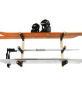 Handcrafted Natural Wood Wall Mount Skateboard Rack Holds Three Longboards And Snowboards Featuring Protective Cushioned Sleeves, showcasing orange skis and snowboard.