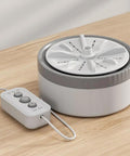 Compact Clothes Washing Machine With Kickin Double Turbo Drum That Washes Away Stubborn Marks Slick Space Saving Profile Paired With Usb Rechargeable Cell For Zero Stress Laundry Routines Anywhere You Go on a wooden surface.