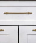 10 Pack 5 Inch 128 mm Brushed Brass Cabinet Pulls Solid Heavy Duty Drawer Handles for Kitchen Cupboard and Dresser Rust Resistant Gold Hardware Easy Breezy Install Hella Durable Cabinet Hardware on white drawers.