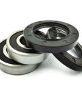 Top Shelf Washer Tub Bearing And Seal Kit Quashes That Bad Rattling Noise Real Quick Compatible With Whirlpool Maytag Setups Part Numbers W10772619 W10290562 - four durable seals stacked together.