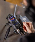 Hustle Ready Podcast Creator Kit Featuring A Sick Four Channel Handheld Recorder shown on a table with recording controls visible.