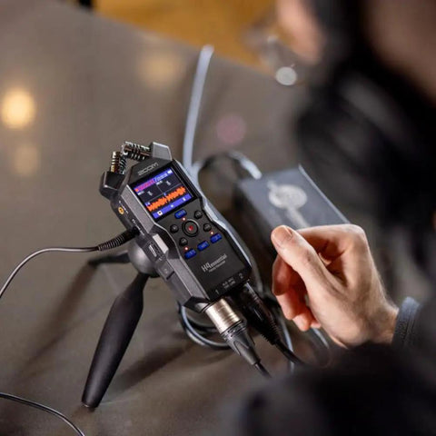 Hustle Ready Podcast Creator Kit Featuring A Sick Four Channel Handheld Recorder shown on a table with recording controls visible.
