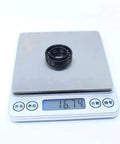 2Pcs Rugged Workhorse Full Ball Thin Section Bearings TB6903 on digital scale showing weight 16.74g, precision engineered for industry.