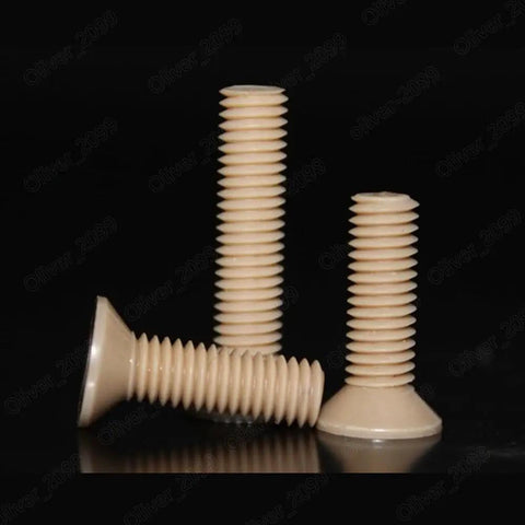 Premium PEEK Plastic Phillips Countersunk Flat Head Screws M6 X 40mm Pack Of Twenty showcasing three screws on a reflective surface.