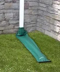 Automatic Drain Away Downspout Extender For Foundation Protection attached to house downspout on grass lawn