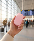 Hand holding Grab and Go Disposable Soap Sheets Set in airport, 5 Boxes of Fragrant Paper Soap for Quick Hand and Foot Cleanups.