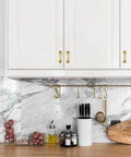 Top Notch Gold Cabinet Pulls For Modern Kitchens, 3 Inch Center To Center Hole Spacing, Sleek Brushed Brass Drawer Handles on white cabinetry