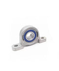 Smooth As Butter Stainless Steel Miniature Pillow Block Bearing Unit With Low Friction Ball Insert For Tight Machine Fits And Wet Workspaces At Twenty Millimeters, side view showing blue sealed ball bearing.