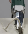 Pro Grade Heavy Duty Electric Fiber Cement Siding Cutter With Six Point Five Amp Motor cutting through fiber cement material.