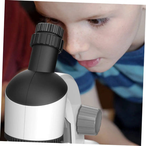 Child using Kid Friendly Microscope Kit With High Definition Magnifier And LED Light For Educational Science Exploration.