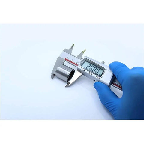 Measuring 26mm drawn cup roller bearing diameter with calipers, showcasing Real Tight Five Piece One Way Needle Roller Clutch And Drawn Cup Bearing Set.