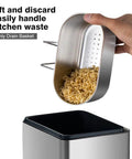 Super Solid Stainless Steel Hanging Sink Strainer Basket that Makes Catching Food Scraps Absolute No Sweat For Kitchen Drains Filters Gunk And Washes Produce Dead Simple Silver Finish with noodles being lifted.