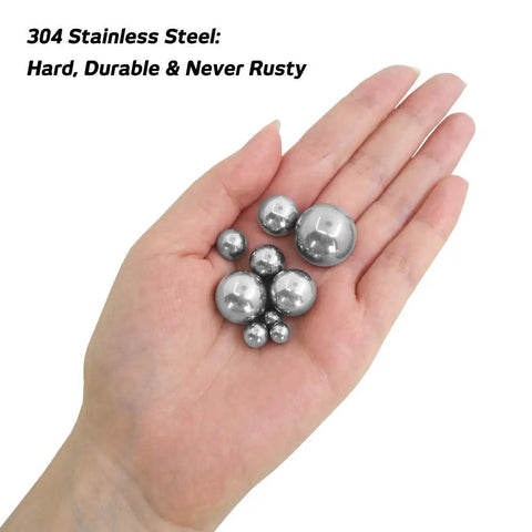 Top Shelf Stainless Steel Forging Balls Assortment For Custom Coin Ring Making Heavy Duty Tool Set held in hand.