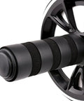 Close-up of Flat Stomach Hustle 6 In 1 Ab Wheel Roller Kit grip handle with textured surface for better traction.