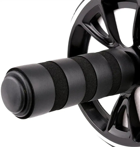 Close-up of Flat Stomach Hustle 6 In 1 Ab Wheel Roller Kit grip handle with textured surface for better traction.