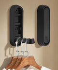 Heavy Duty Foldable Wall Hooks 4 Pack Aluminum Alloy Rustproof Flip Up Mounts With Screws Black displaying hooks on wall.