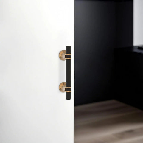 Top Shelf Black And Champagne Bronze Cabinet Handles 10 Pack Slick Drawer Pulls For Closets Kitchen Cupboards Wine Coolers Real Heavy Duty Aluminum Zinc Alloy Hardware displayed on a white cabinet door.