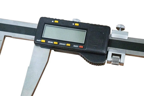 Heavy Duty Digital Caliper Delivers Zero To 1500 Millimeter And Zero To Sixty Inch Range With Tough Stainless Steel Body close-up view of display and adjustment wheel.