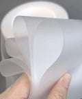 Urethane Die Protection Film For Press Brake Bending 4 Inch Wide 0.012 Inch Thick 100 Foot Roll shown in hand view.
